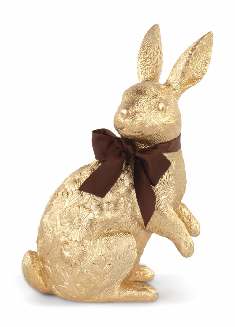Lapin de Pâques doré avec ruban rouge