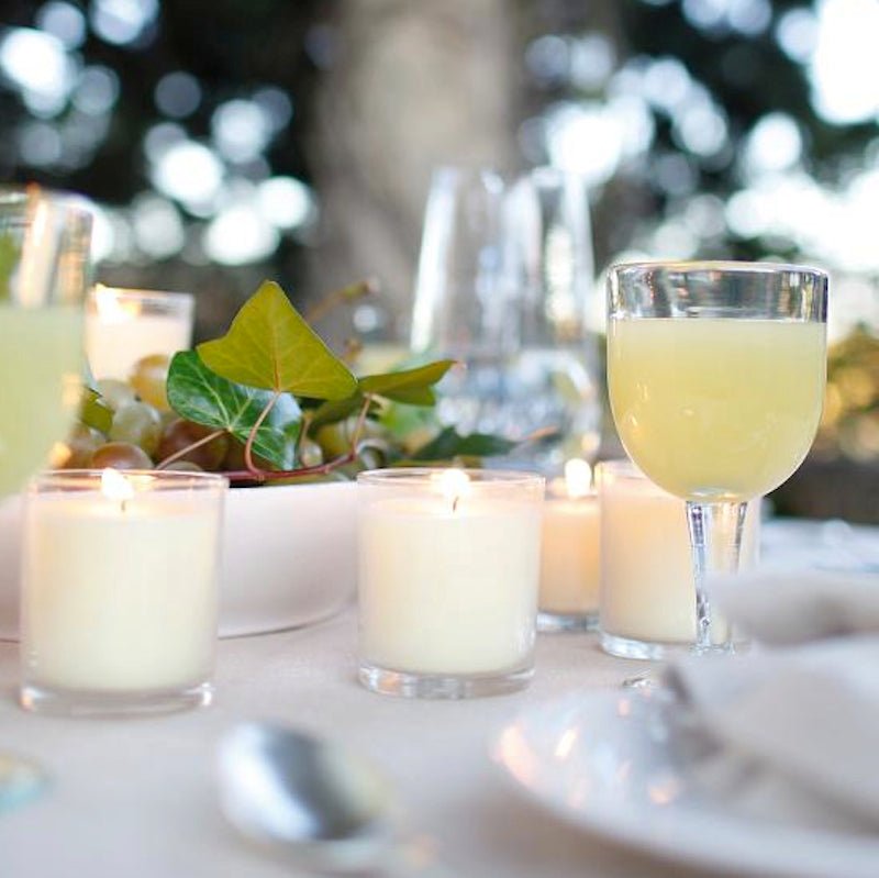 Lot de 24 bougies non parfumées dans un verre transparent - Couleur ivoire - Koddel.com